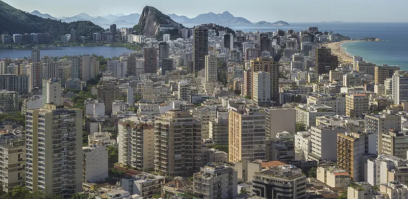 Elevated view of Rio de Janeiro’s South Zone, looking east and northeast from Morro Dois Irmãos. In the foreground and middle distance: Leblon, below, contin...